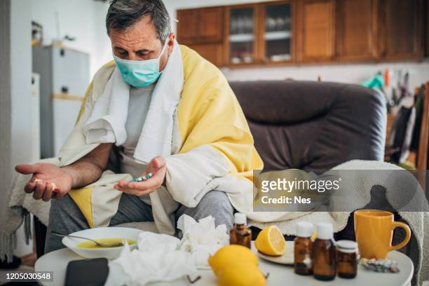 senior man sick with corona virus - quarantine stock pictures, royalty-free photos & images