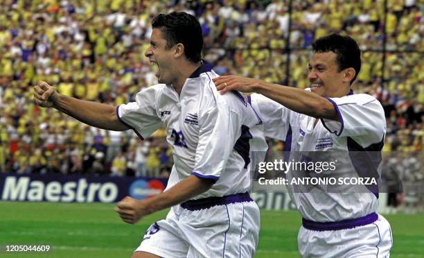 Junior Izaguirre and Ricky Garcia , of Honduras, celebrate the second goal of the Uruguayan team, 29 July 2001 on the Nemesio Camacho Stadium in...