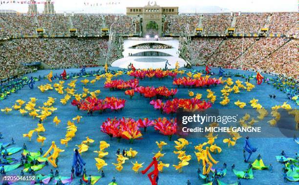 Dancers perform on the field of the Olympic Stadium 25 July 1992 during the opening ceremonies. Some 275 gold medals will be awarded during the two...