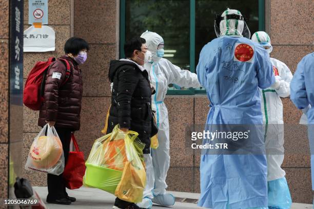 Patients infected by the COVID-19 coronavirus leave from Wuhan No.3 Hospital to Huoshenshan Hospital in Wuhan in China's central Hubei province on...