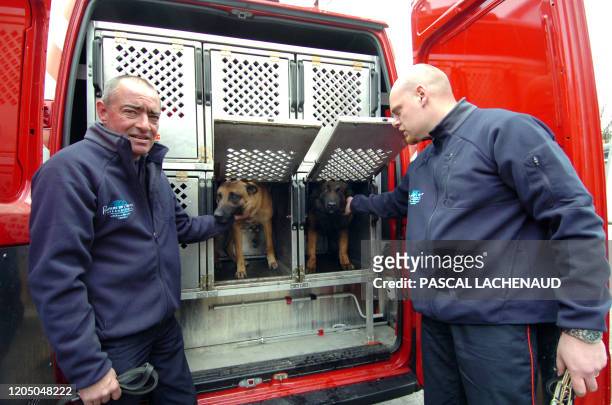 French firemen and dog handlers load their truck on April 7, 2009 in Limoges, southern France, prior to their departure to Italy to join the rescue...