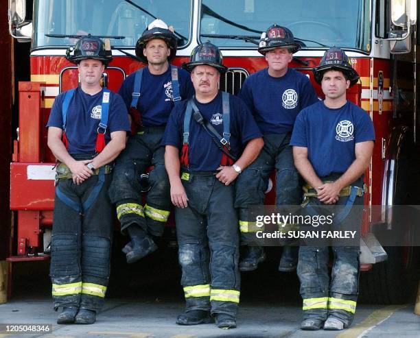 Ladder 31 firemen Charles J. McCormack , Richie Ramaizel , Kevin McGeary, , John McGonigle and Vincent Holfester stand in front of their truck 05...