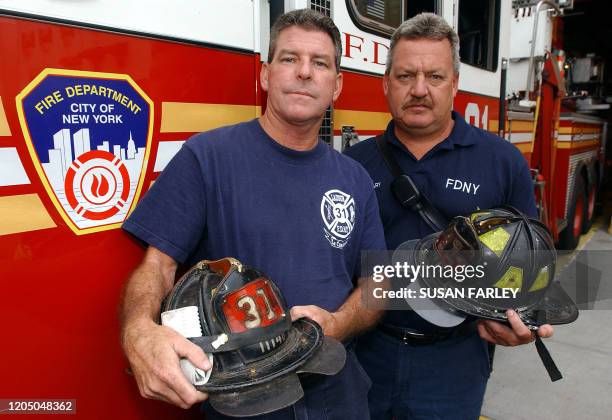 Ladder 31 Firemen John McGonigle and Kevin McGeary stand in front of their truck 28 August in the Bronx, NY. McGonigle and McGeary were subjects in...