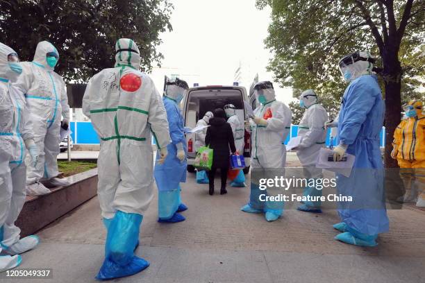 Medical workers prepare to transfer Covid-19 patients from the No.3 Hospital to Huoshenshan Hospital in Wuhan in central China's Hubei province...