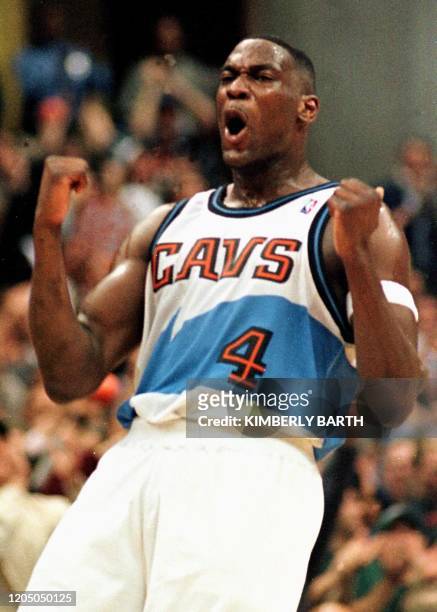 Cleveland Cavaliers forward Shawn Kemp celebrates after the Cavaliers defeated the Indiana Pacers 86-77 in game three of the first round of the NBA...