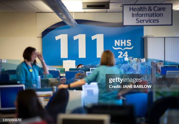 Staff supporting Scotland's public information response to the new coronavirus, COVID-19, are pictured as they work at the NHS 24 contact centre at...