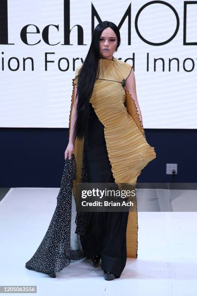 Model walks the runway wearing Art Elio Fashion Designer during NYFW Powered By hiTechMODA on February 08, 2020 in New York City.