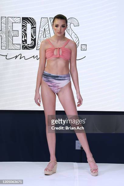 Model walks the runway wearing The Days Swimwear during NYFW Powered By hiTechMODA on February 08, 2020 in New York City.
