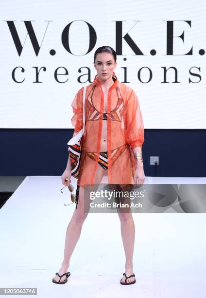 Model walks the runway wearing WOKE Creations during NYFW Powered By hiTechMODA on February 08, 2020 in New York City.