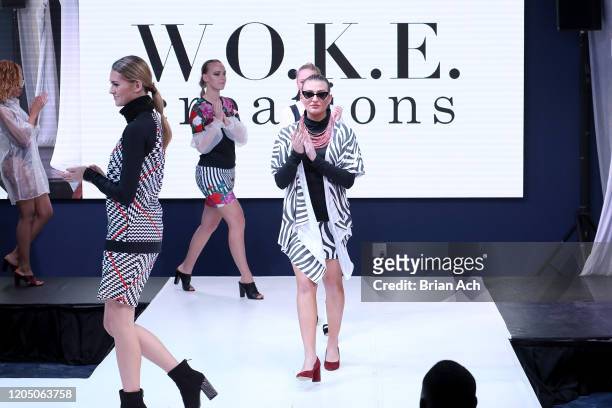 Models walk the runway wearing WOKE Creations during NYFW Powered By hiTechMODA on February 08, 2020 in New York City.