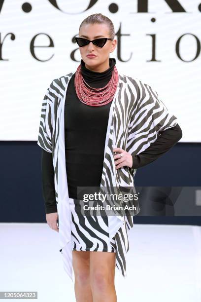 Model walks the runway wearing WOKE Creations during NYFW Powered By hiTechMODA on February 08, 2020 in New York City.