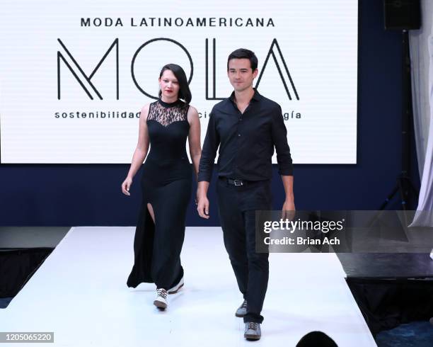 The Cappaz designers walk the runway wearing EILEAN during NYFW Powered By hiTechMODA on February 08, 2020 in New York City.