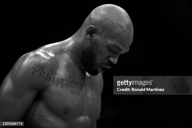 Jon Jones walks to his corner in between rounds against Dominick Reyes in their UFC Light Heavyweight Championship bout during UFC 247 at Toyota...