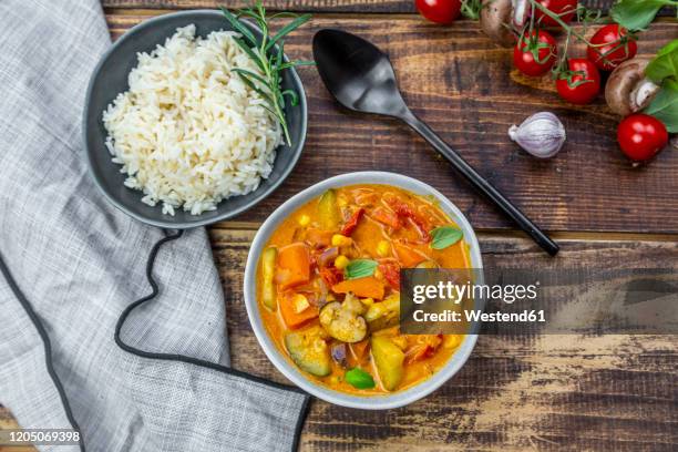 bowls of potato curry and rice - rice grain stock-fotos und bilder