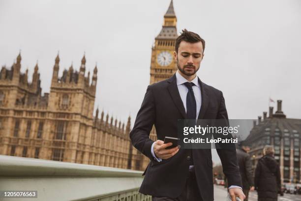 business on the go in london - person falls from westminster bridge stock-fotos und bilder