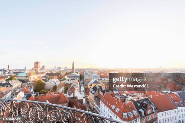 denmark, copenhagen, clear sky over old town skyline at dusk - denmark skyline stock pictures, royalty-free photos & images