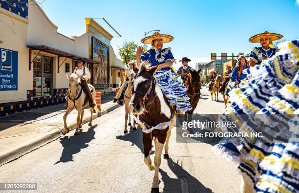 young woman in rodeo parade at market square - market square stock pictures, royalty-free photos & images