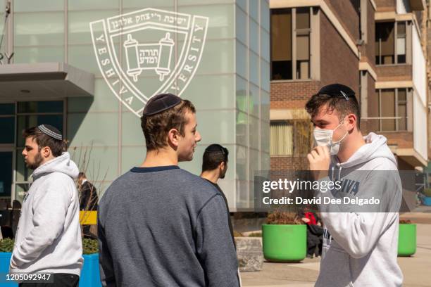 Yeshiva student wears a face mask on the grounds of the university on March 4, 2020 in New York City. A Yeshiva student has tested positive for...