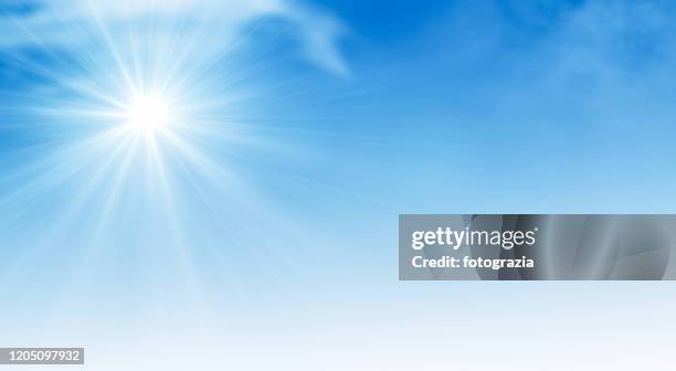 sun on blue sky - blue sky background stockfoto's en -beelden