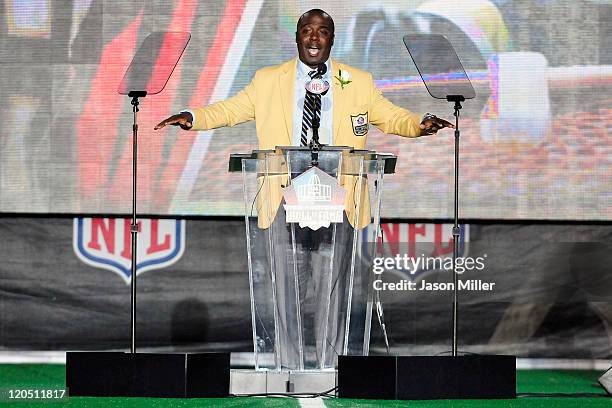 Former St. Louis Rams running back Marshal Faulk talks to the fans after uveiling his bust at the Enshrinement Ceremony for the Pro Football Hall of...