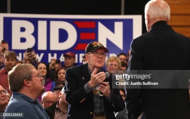 Democratic presidential candidate former Vice President Joe Biden listens as an attendee asks a question during a campaign event on February 09, 2020...