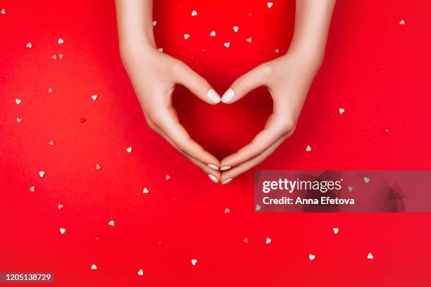 hands forming a beautiful heart - hand in heart shape stock pictures, royalty-free photos & images