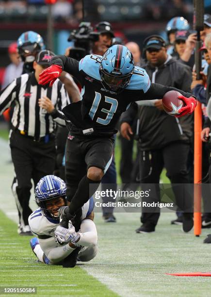 Darius Hillary of the St. Louis Battlehawks tackles Jeff Badet of the Dallas Renegades in the first half of an XFL Football game on February 09, 2020...