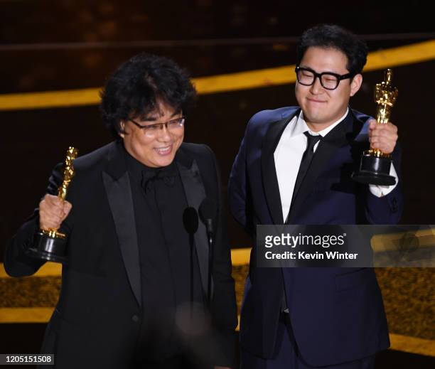 Bong Joon-ho and Han Jin-won accept the Writing - Original Screenplay - award for 'Parasite' onstage during the 92nd Annual Academy Awards at Dolby...
