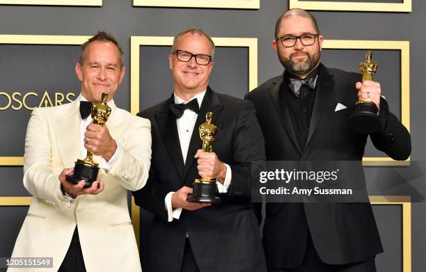 Filmmakers Jonas Rivera, Mark Nielsen and Josh Cooley, winners of the Animated Feature Film award for “Toy Story 4,” pose in the press room during...