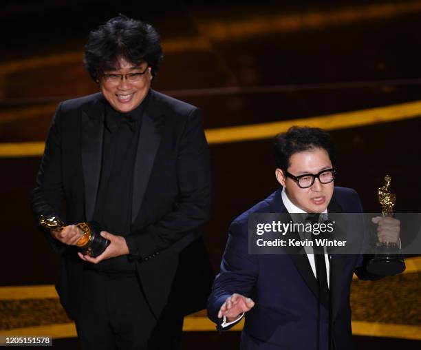 Bong Joon-ho and Han Jin-won accept the Writing - Original Screenplay - award for 'Parasite' onstage during the 92nd Annual Academy Awards at Dolby...