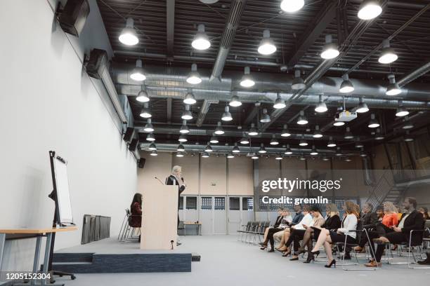 group of business people in the convention center - large conference event stock pictures, royalty-free photos & images