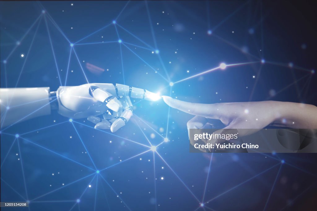 Woman touching robot finger