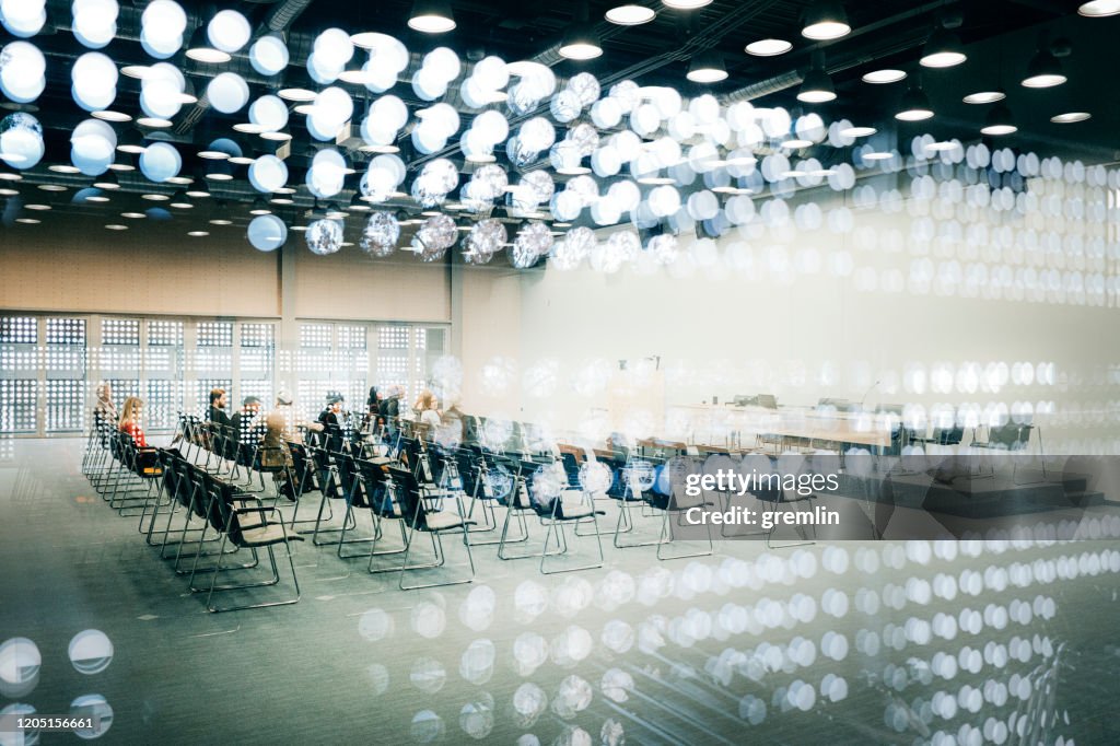 Abstract group of business people in the convention center