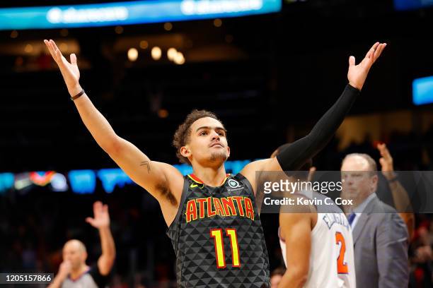 Trae Young of the Atlanta Hawks reacts after hitting a three-point basket in double overtime against the New York Knicks at State Farm Arena on...
