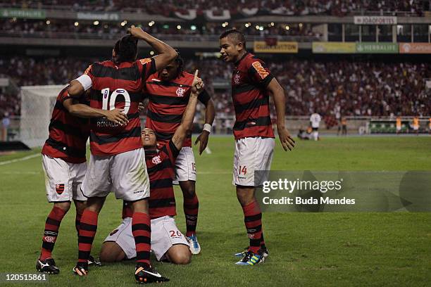 Players of Flamengo celebrate a scored goal againist Coritiba during a match as part of Serie A 2011 at Engenhao stadium on August 06, 2011 in Rio de...