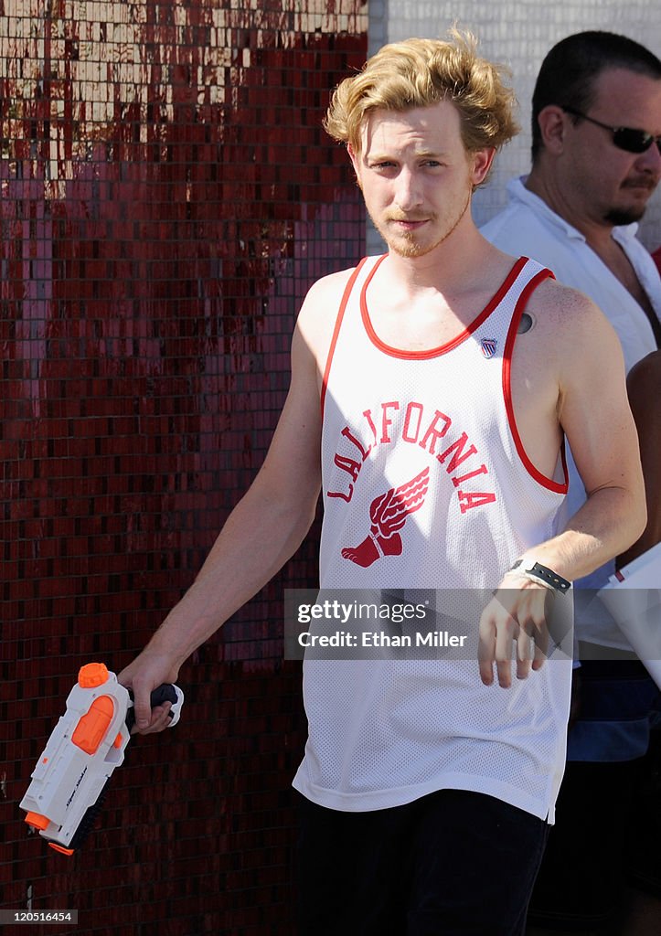 Like Asher Roth The Rapper Rapper Asher Roth holds a water gun as he performs at the Moorea ...