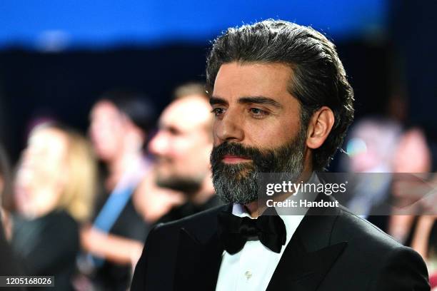 In this handout photo provided by A.M.P.A.S. Oscar Isaac looks on backstage during the 92nd Annual Academy Awards at the Dolby Theatre on February...