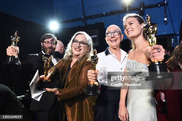 In this handout photo provided by A.M.P.A.S. Oscar winners Jeff Reichert, Carol Dysinger, Julia Reichert, and Elena Andreicheva pose backstage during...