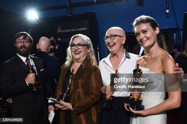 In this handout photo provided by A.M.P.A.S. Oscar winners Jeff Reichert, Carol Dysinger, Julia Reichert, and Elena Andreicheva pose backstage during...