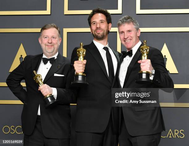 Visual effects supervisors Guillaume Rocheron, Dominic Tuohy, and Greg Butler, winners of the Visual Effects award for “1917,” pose in the press room...