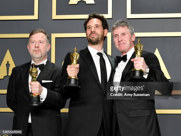 Visual effects supervisors Guillaume Rocheron, Dominic Tuohy, and Greg Butler, winners of the Visual Effects award for “1917,” pose in the press room...
