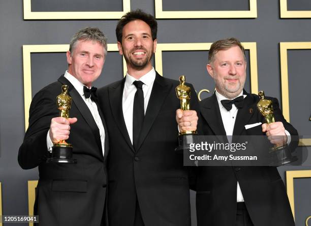 Visual effects supervisors Guillaume Rocheron, Dominic Tuohy, and Greg Butler, winners of the Visual Effects award for “1917,” pose in the press room...