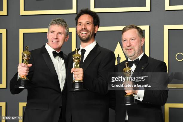 Dominic Tuohy, Guillaume Rocheron and Greg Butler, winners of the Visual Effects award for “1917,” pose in the press room during the 92nd Annual...