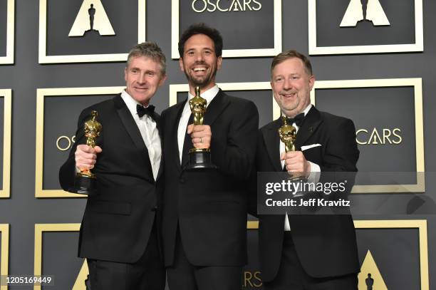 Visual effects artists Dominic Tuohy, Guillaume Rocheron and Greg Butler, winners of the Visual Effects award for "1917," pose in the press room...