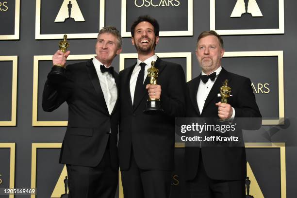 Visual effects artists Dominic Tuohy, Guillaume Rocheron and Greg Butler, winners of the Visual Effects award for "1917," pose in the press room...