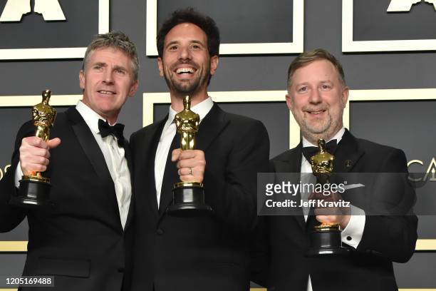 Visual effects artists Dominic Tuohy, Guillaume Rocheron and Greg Butler, winners of the Visual Effects award for "1917," pose in the press room...