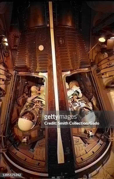 Astronauts James McDivitt and Ed White inside the Gemini spacecraft preparing for a simulated launch at Cape Canaveral, Florida, May 13, 1965. Image...