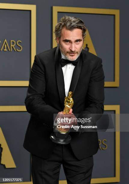 Joaquin Phoenix, winner of the Actor in a Leading Role award for “Joker,” poses in the press room during the 92nd Annual Academy Awards at Hollywood...