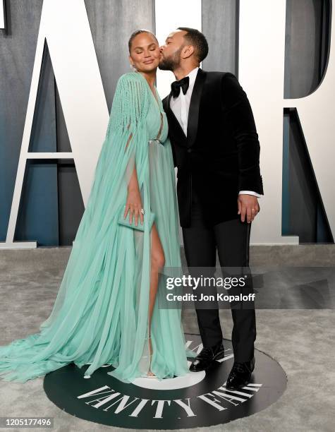 Chrissy Teigen and John Legend attend the 2020 Vanity Fair Oscar Party hosted by Radhika Jones at Wallis Annenberg Center for the Performing Arts on...