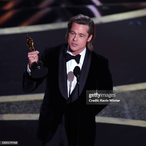 Brad Pitt accepts the Actor in a Supporting Role award for 'Once Upon a Time...in Hollywood' onstage during the 92nd Annual Academy Awards at Dolby...